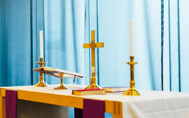 Cross and candles on the table